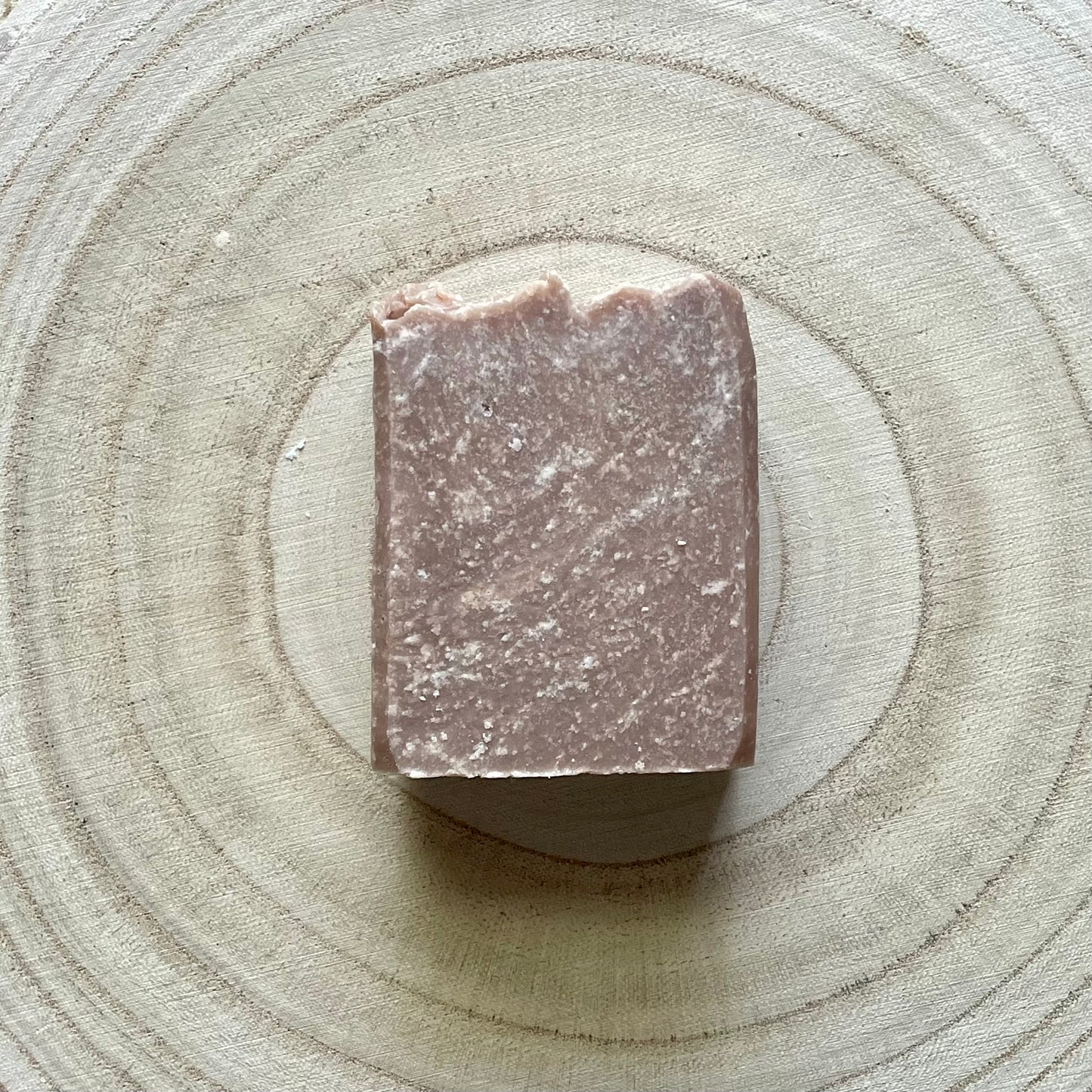 Single bar of soap, dark brown in color, vanilla bean scent.