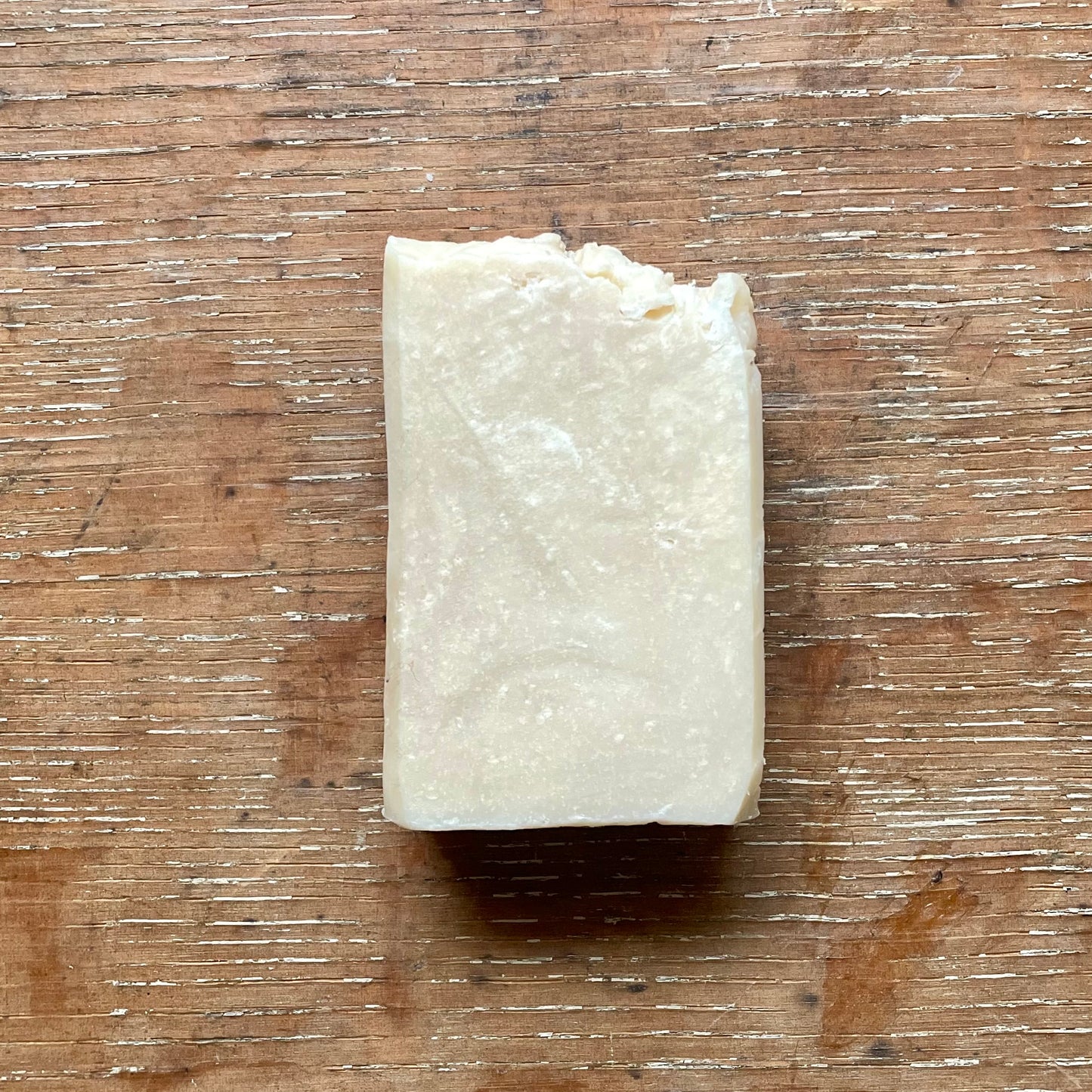One bar of soap, off white in color with white specks, eucalyptus and spearmint scent.