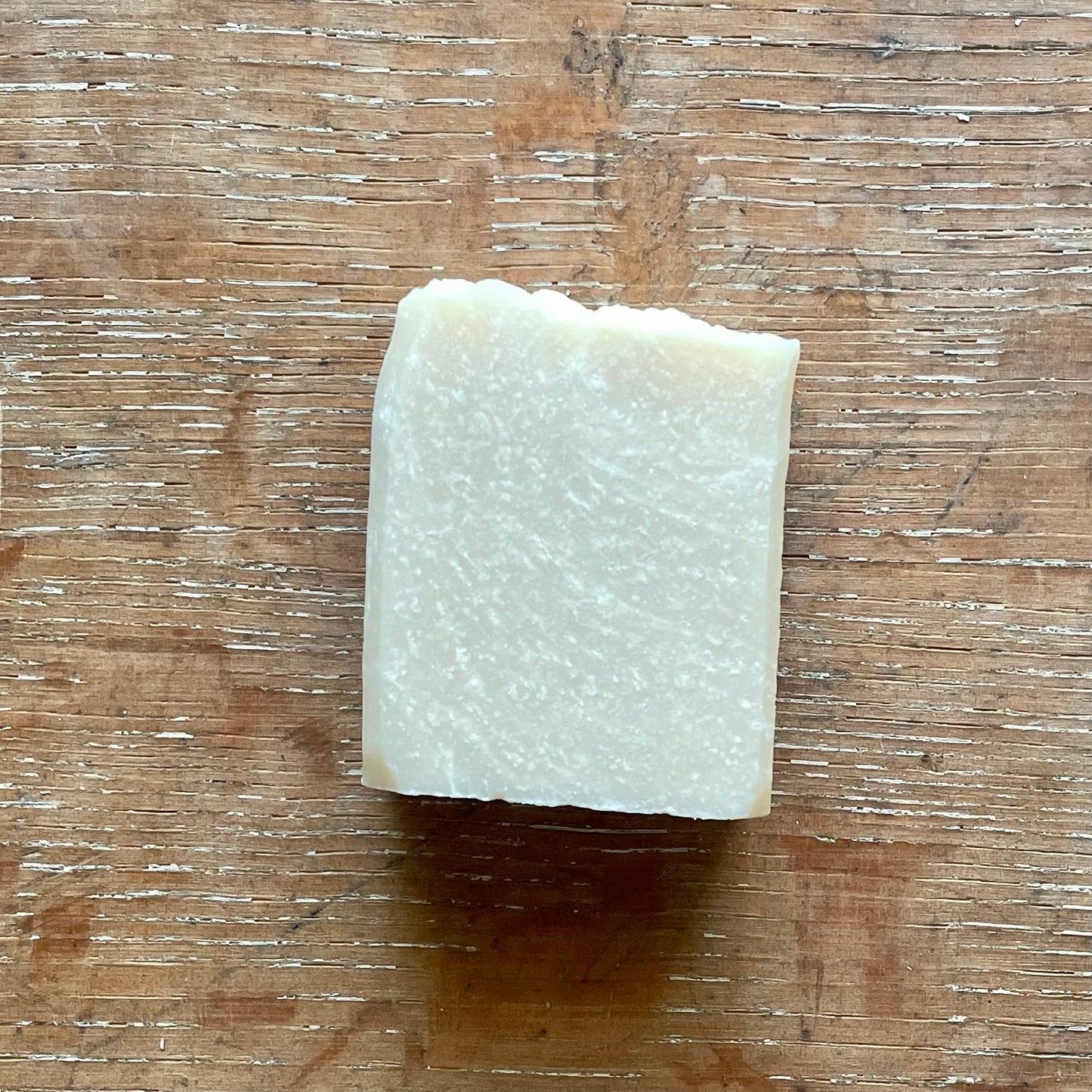 One bar of soap, off white in color with white specks, honeysuckle scent.