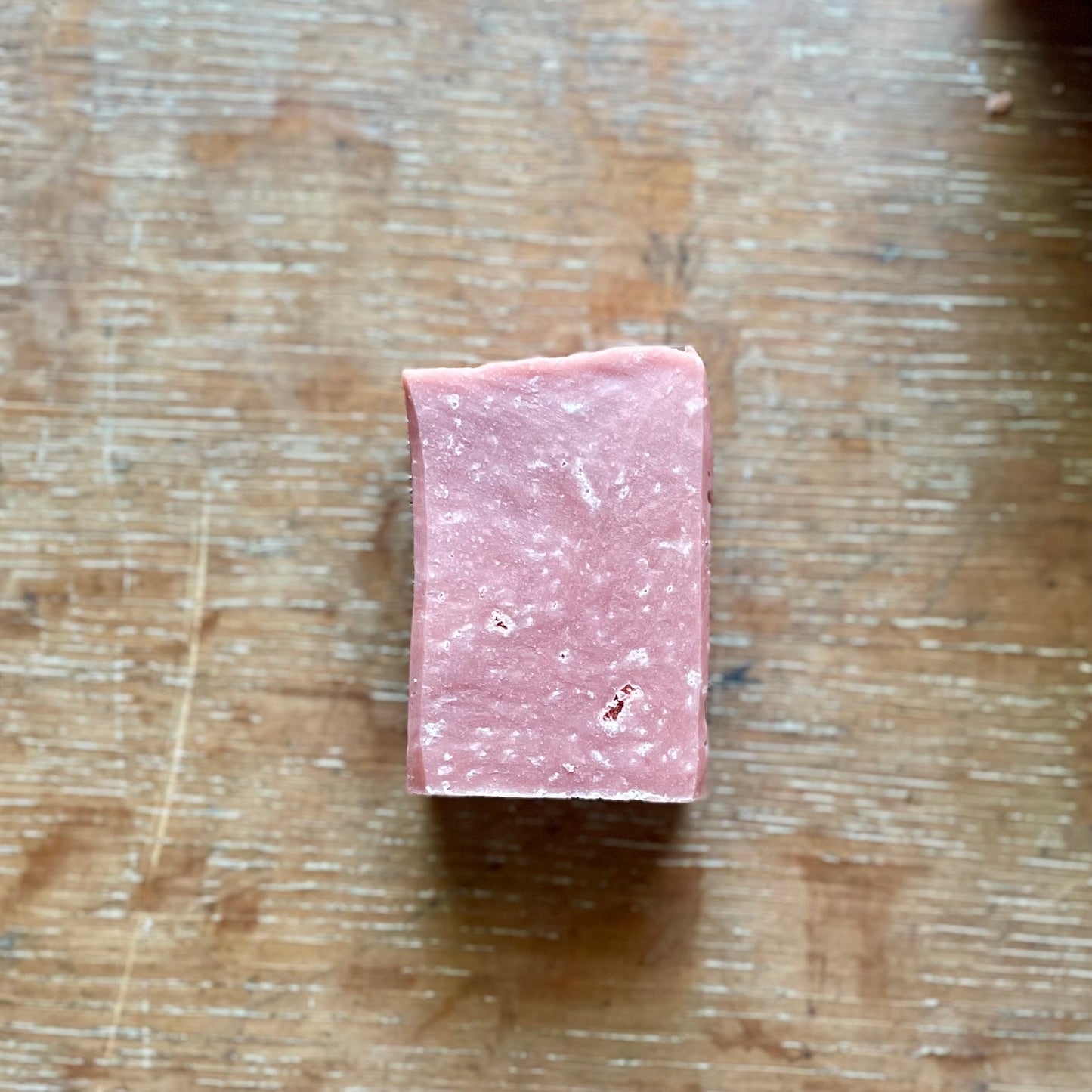 One bar of soap, medium pink in color, strawberries and cream scent.