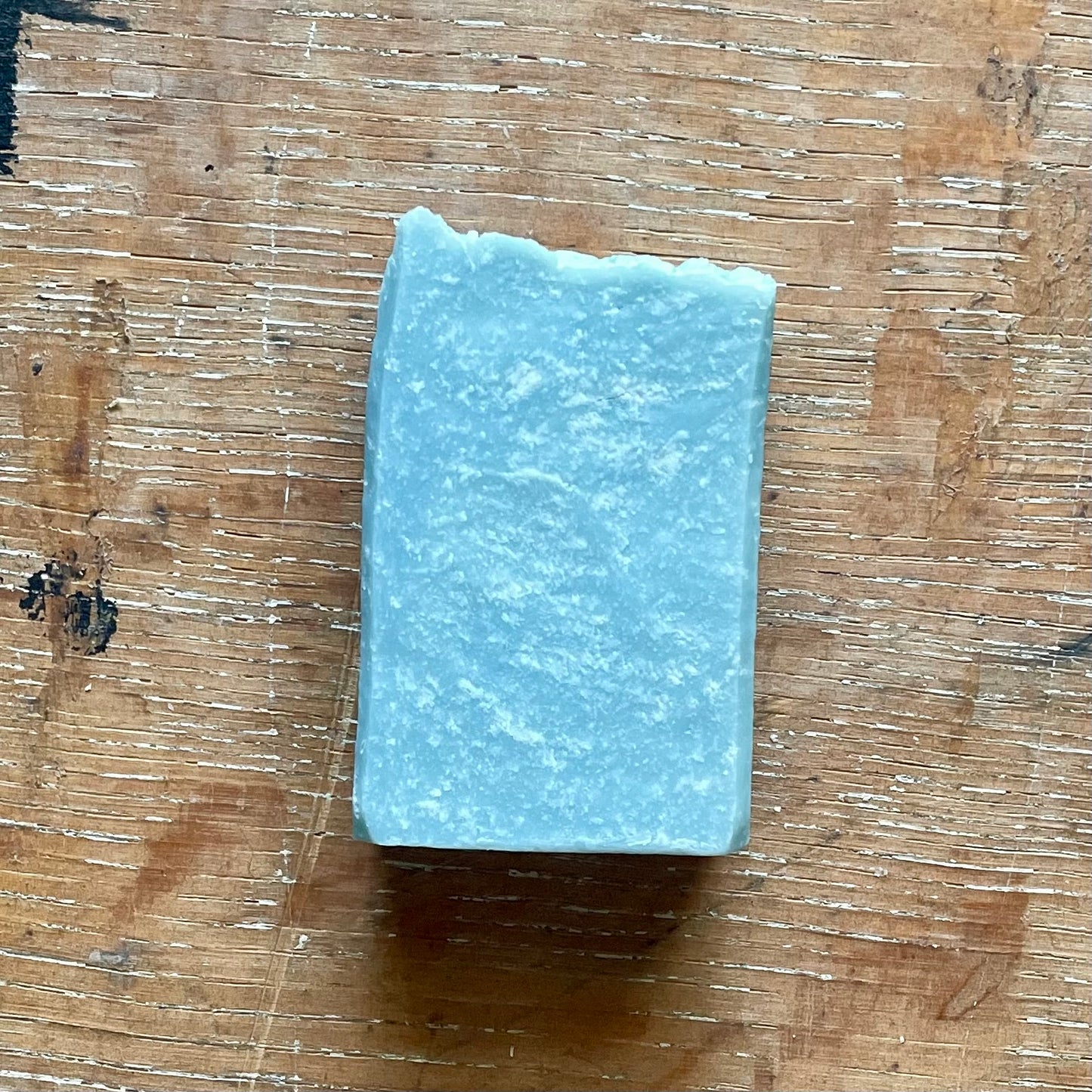 One bar of soap, medium blue in color with white specks, ocean mist scent.