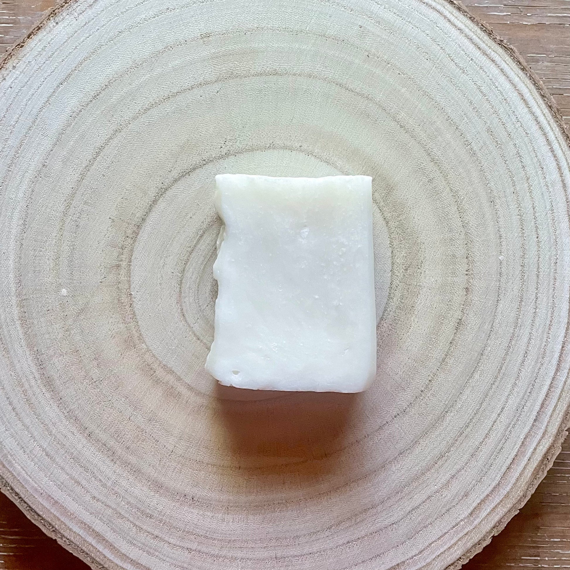 Single bar of soap, white in color, unscented. 
