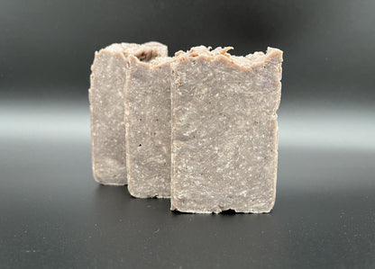 Three soap bars, brownish in color with white specks.