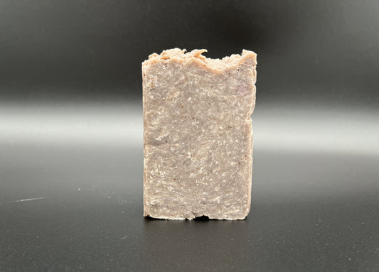 Single soap bar, brownish speckled in color.