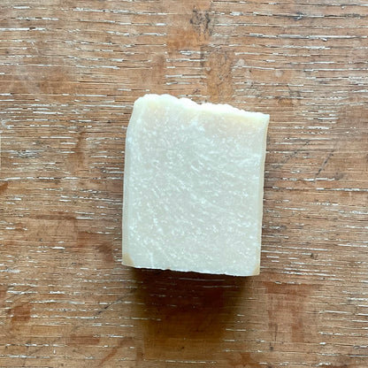 One bar of soap, off white in color with white specks, honeysuckle scent. 