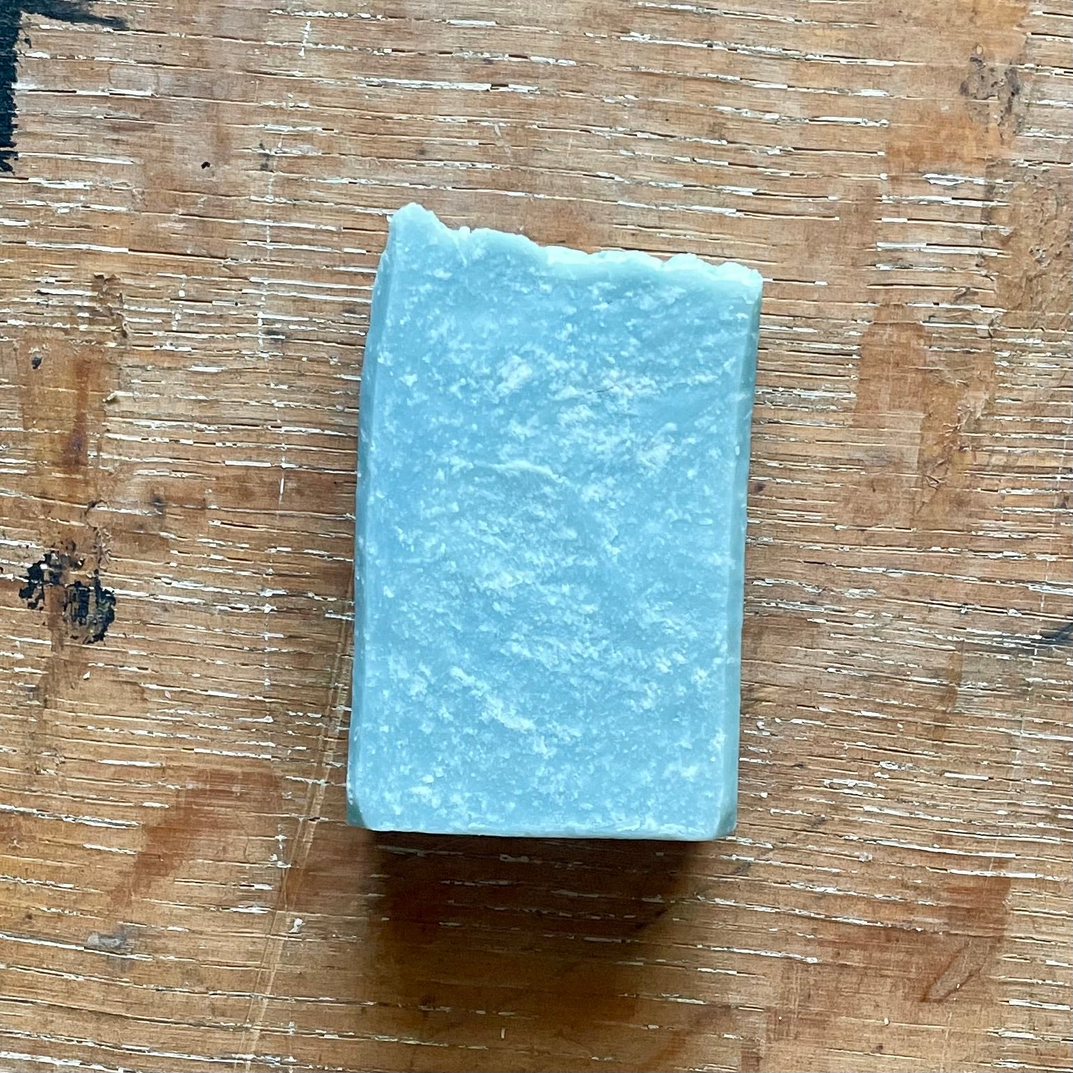 One bar of soap, medium blue in color with white specks, ocean mist scent.