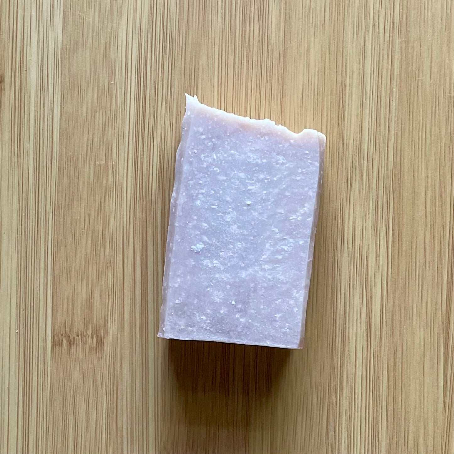 One bar of soap, tan in color with white specks, vanilla sugar scent. 